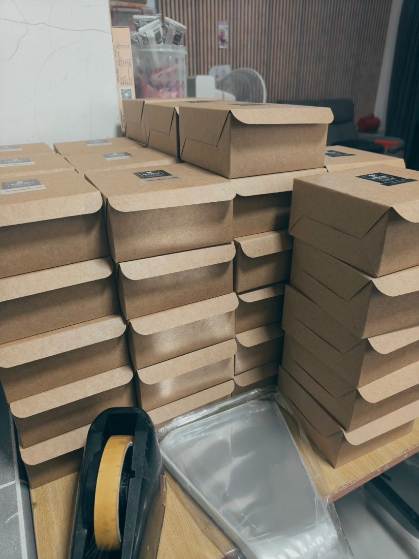 Stacked Mekin catering boxes ready for delivery