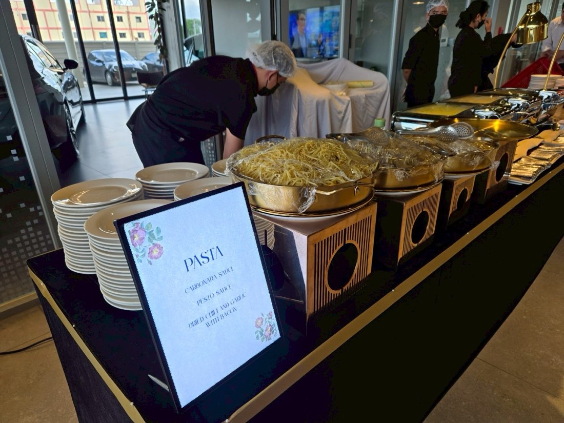Mekin buffet catering station professionally set up at a corporate venue